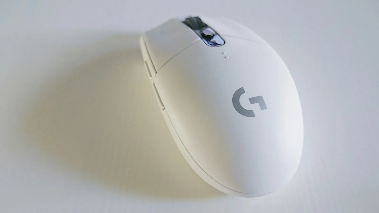 Gaming mouse with RGB lighting on a desk pad